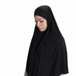 The back view of a Black Patterned Embellished Hijab showcasing a central rhinestone sunburst design and subtle all-over geometric pattern on the flowing fabric.