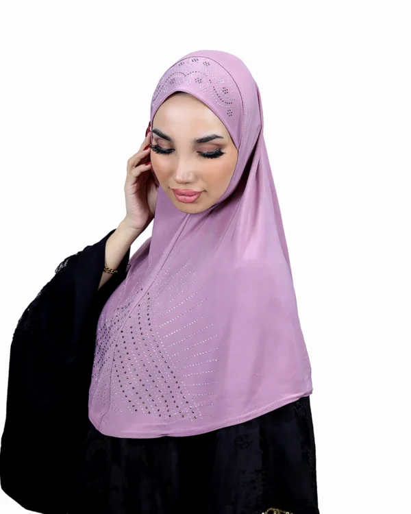 A woman models a Light Purple Rhinestone Hijab, looking down gently, highlighting the rhinestone pattern and the soft drape of the material.