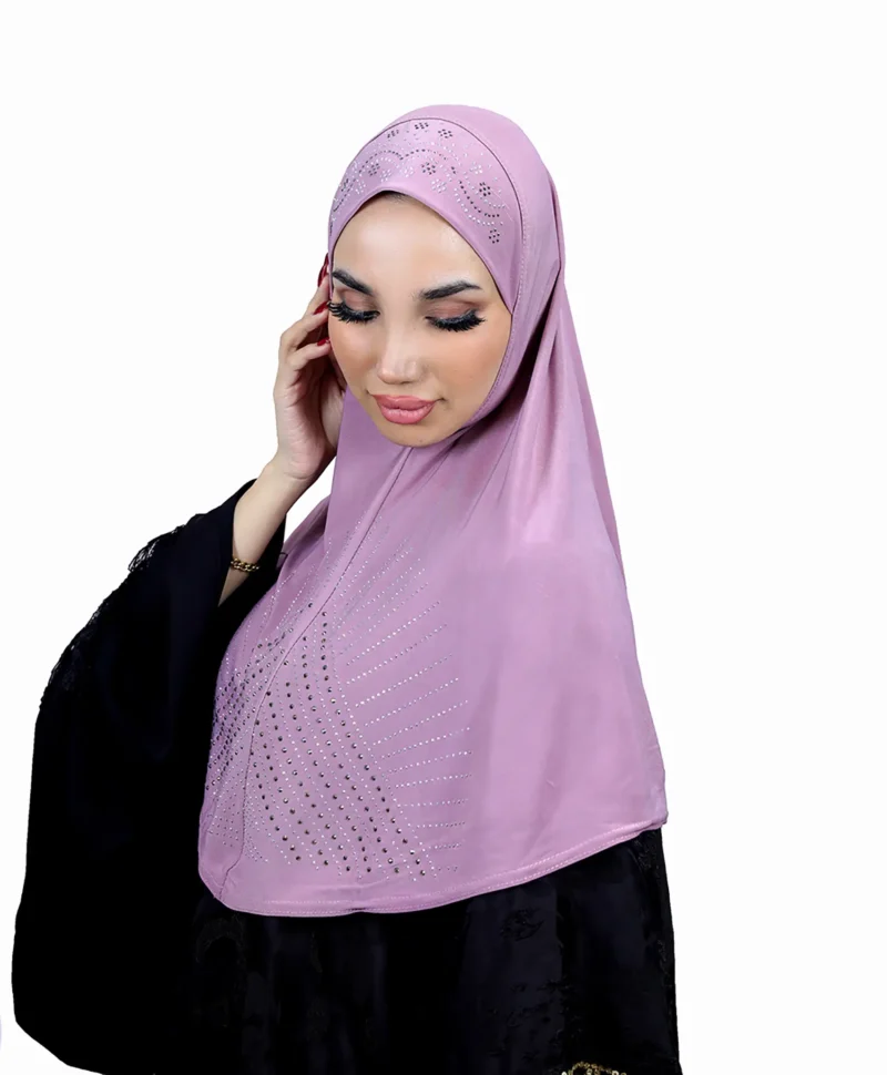 A woman models a Light Purple Rhinestone Hijab, looking down gently, highlighting the rhinestone pattern and the soft drape of the material.