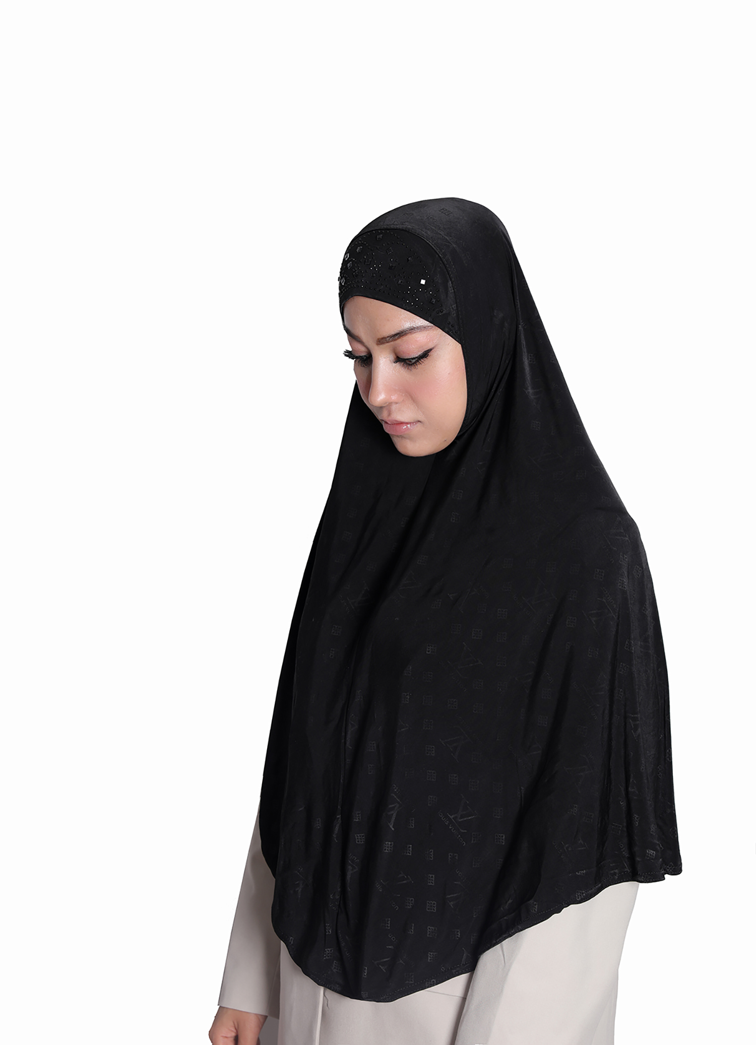 The back view of a Black Patterned Embellished Hijab showcasing a central rhinestone sunburst design and subtle all-over geometric pattern on the flowing fabric.