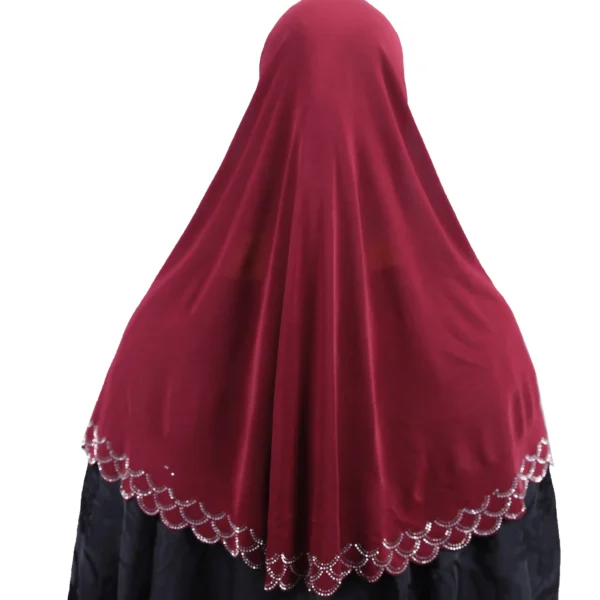 A close-up view of the Maroon Embroidered Hijab with Beadwork, focusing on the elaborate rhinestone cap pattern and the scalloped trim near the collarbone.