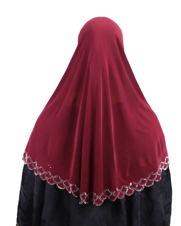 A close-up view of the Maroon Embroidered Hijab with Beadwork, focusing on the elaborate rhinestone cap pattern and the scalloped trim near the collarbone.