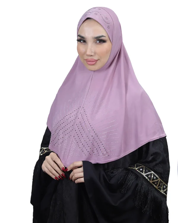 A woman models a Light Purple Rhinestone Hijab, facing forward and showcasing the full front panel with the prominent sunburst rhinestone design.
