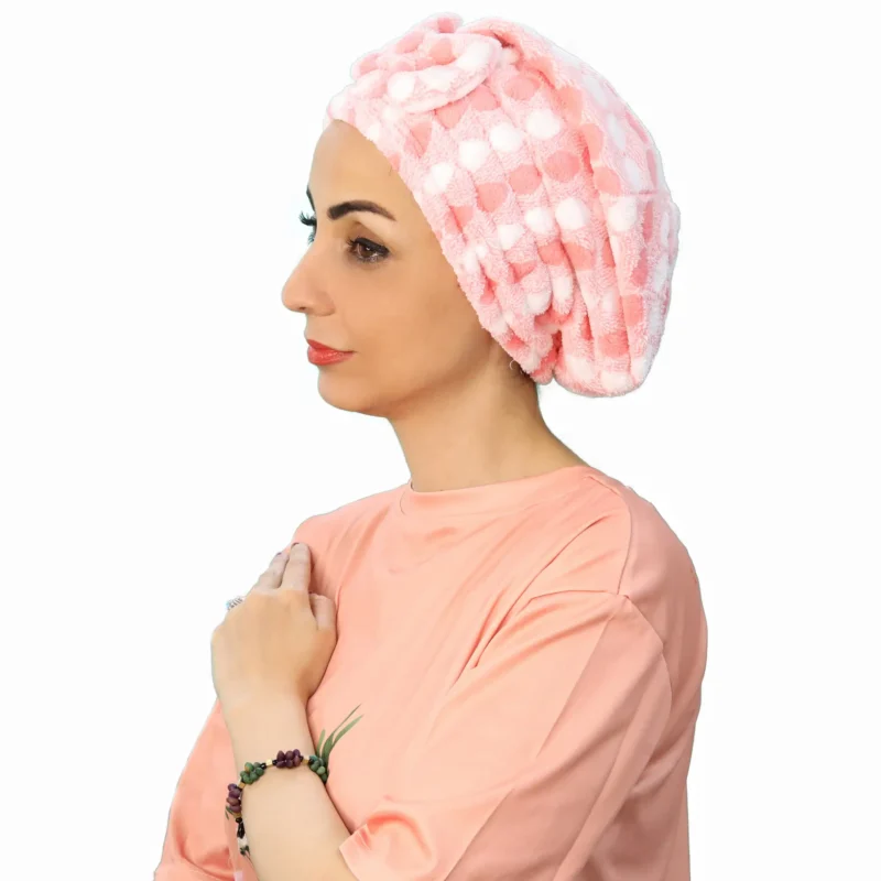 A woman models a Plush Comfort Fashion Turban, viewed from the front, showcasing the elegant pleated design and comfortable, ready-to-wear fit.