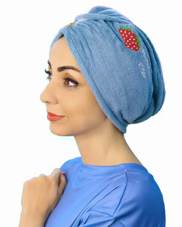 A woman models a Comfortable Embroidered Fashion Turban, viewed from the front, highlighting the soft fabric, full coverage, and the detailed, patterned embroidery centered above the forehead.
