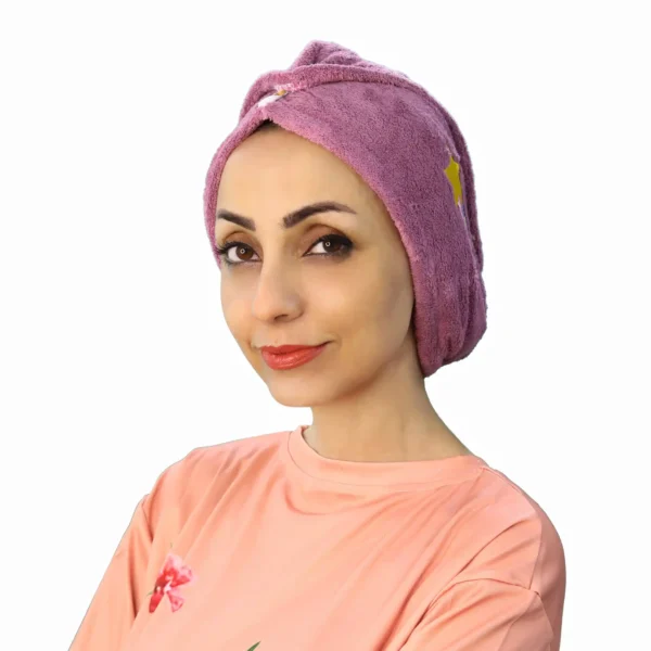 A side view of a woman wearing the Comfortable Embroidered Fashion Turban, emphasizing the pleated design and the neat, fitted shape around the head.