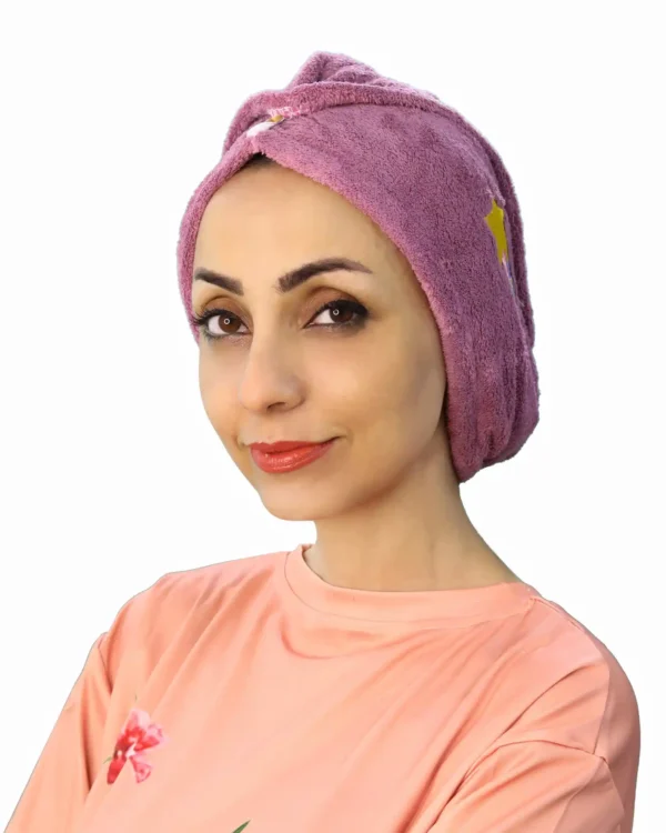 A side view of a woman wearing the Comfortable Embroidered Fashion Turban, emphasizing the pleated design and the neat, fitted shape around the head.