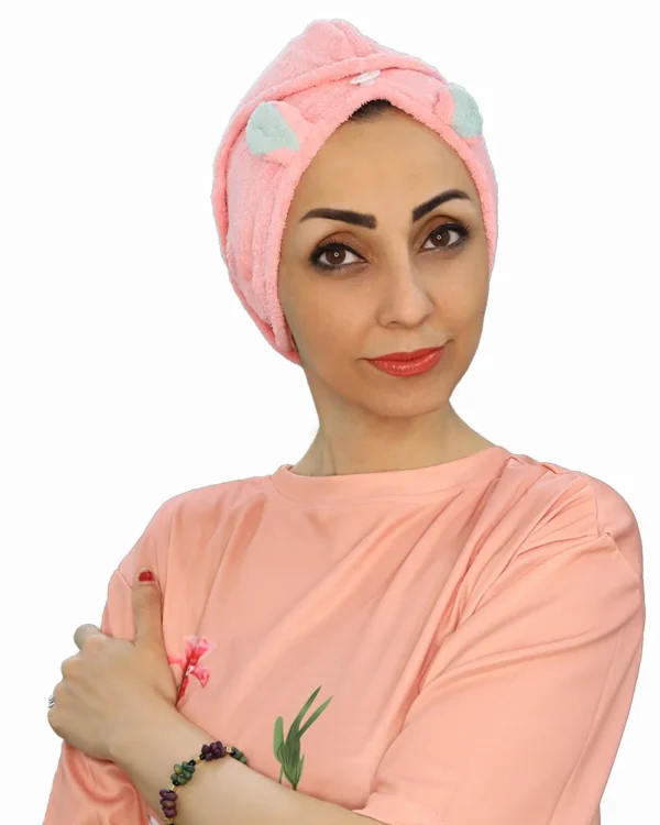 A woman models a Plush Cute Ear Turban Wrap, viewed from the side, emphasizing the soft, comfortable material and the placement of the decorative ears.