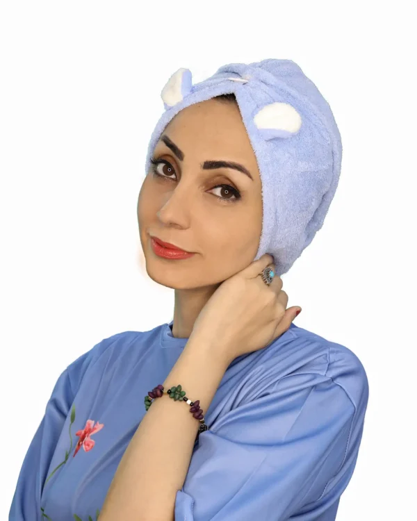 A woman models a fluffy Plush Cute Ear Turban Wrap in a light color, featuring playful rounded ears sewn on top and a gathered front detail.