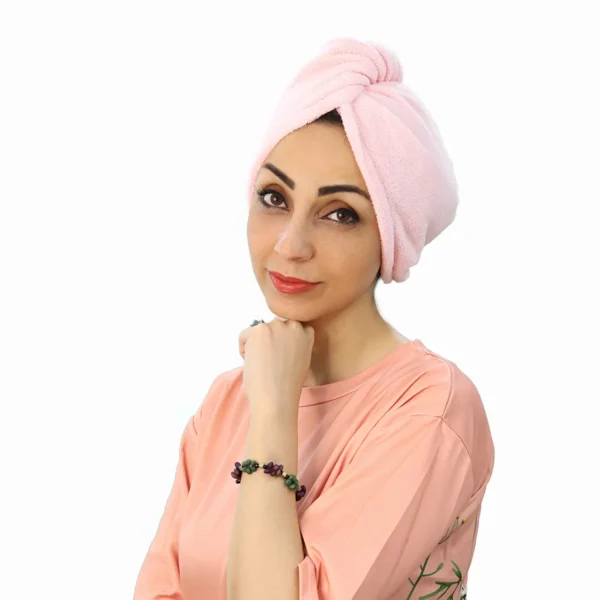 A woman models the Soft Microfiber Hair Drying Turban, facing forward, highlighting the comfortable, fitted design and the quick-drying material.