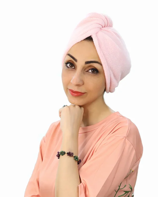 A woman models the Soft Microfiber Hair Drying Turban, facing forward, highlighting the comfortable, fitted design and the quick-drying material.