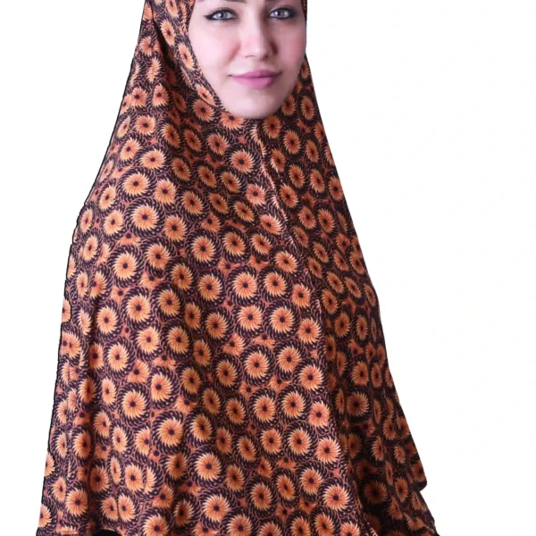 A woman models a Black & Orange Sunburst Rayon Hijab, looking straight at the camera with her hands clasped, emphasizing the full coverage and comfortable fit.