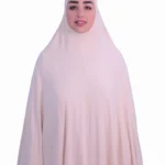 A woman modeling a luxurious fawn beige cotton hijab, viewed from the side, showcasing the elegant drape of the fabric. Luxury Cotton Hijab in Fawn Beige