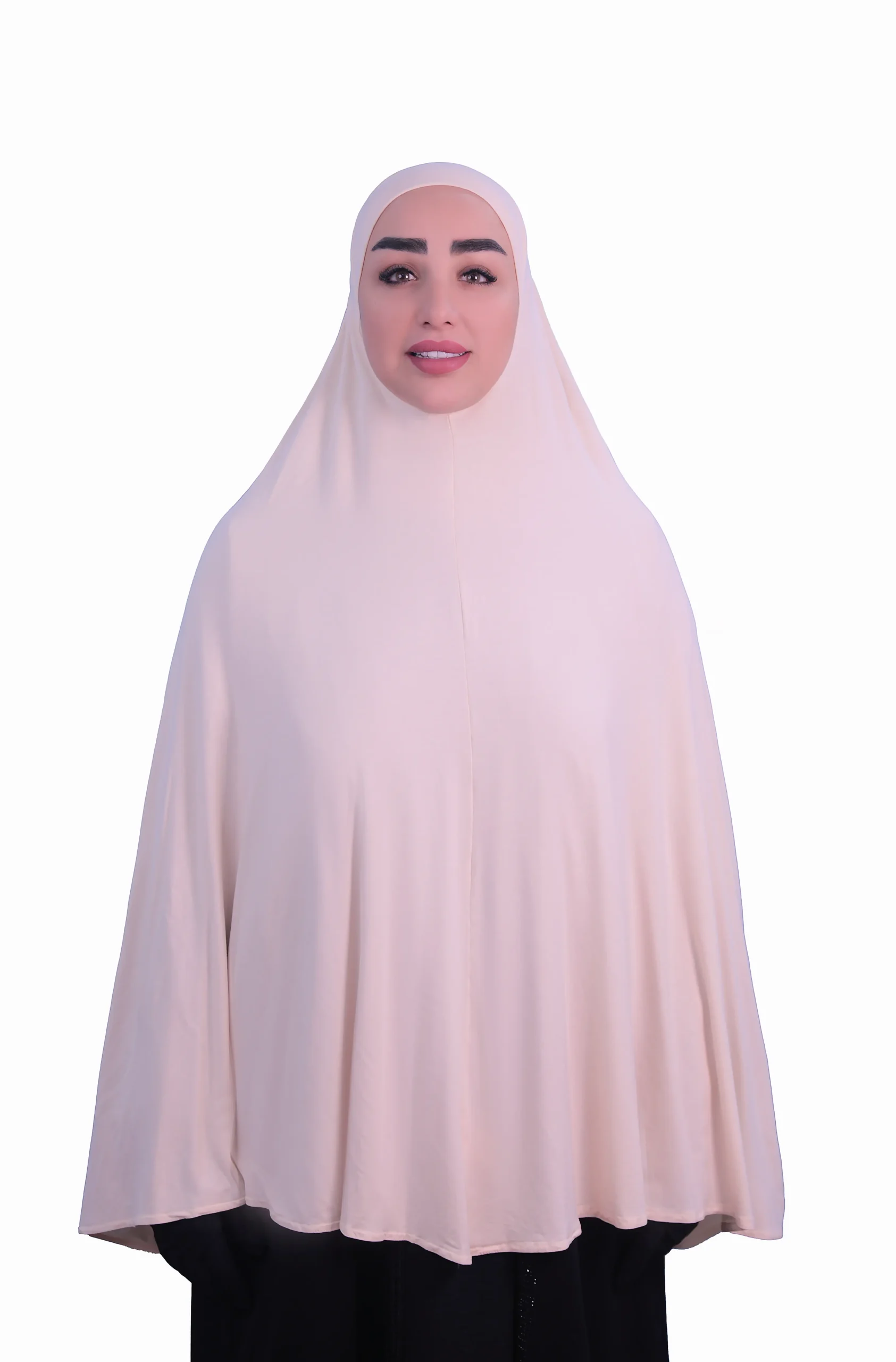 A woman modeling a luxurious fawn beige cotton hijab, viewed from the side, showcasing the elegant drape of the fabric. Luxury Cotton Hijab in Fawn Beige