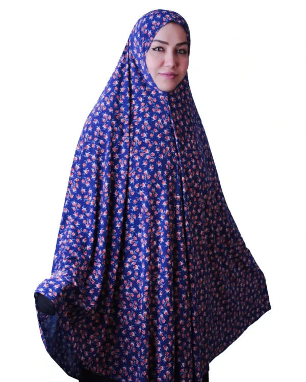 A woman modeling a Premium Blue Floral Rayon Ladies Hijab, looking directly at the camera, showcasing the comfortable and elegant style of the garment.