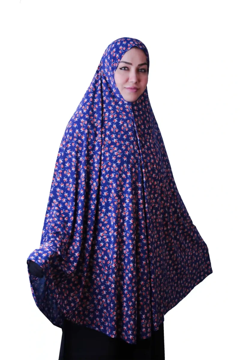 A woman modeling a Premium Blue Floral Rayon Ladies Hijab, looking directly at the camera, showcasing the comfortable and elegant style of the garment.