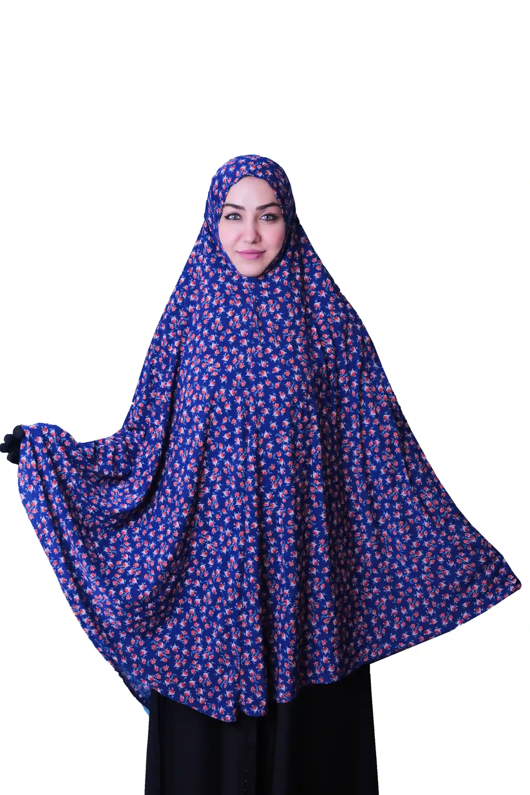 A woman modeling a Premium Blue Floral Rayon Ladies Hijab, standing from the side to show off its beautiful design and drape.