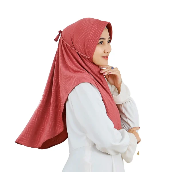 The rear view of the Dusty Rose Chevron Hijab, clearly displaying the full coverage, the adjustable tie-back, and the prominent chevron pattern across the fabric.