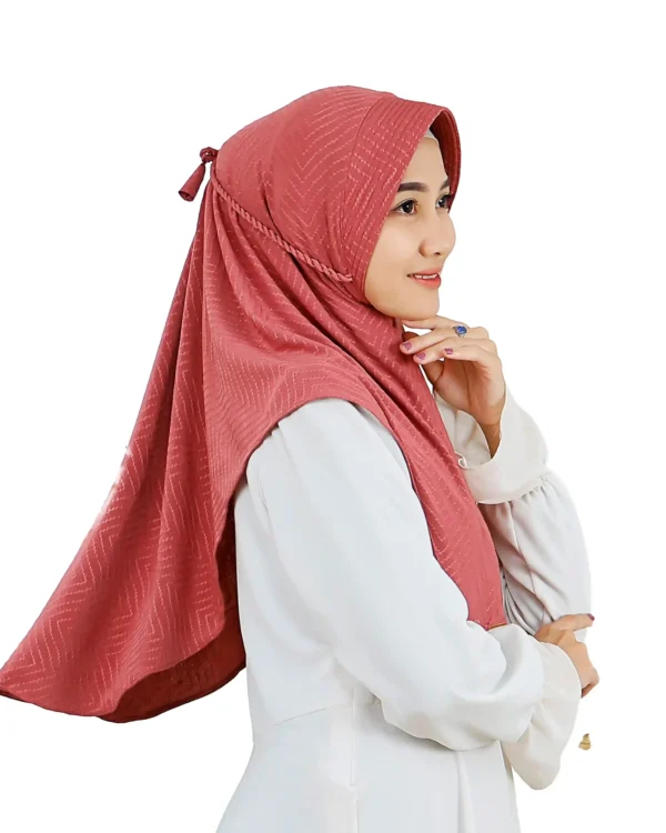 The rear view of the Dusty Rose Chevron Hijab, clearly displaying the full coverage, the adjustable tie-back, and the prominent chevron pattern across the fabric.