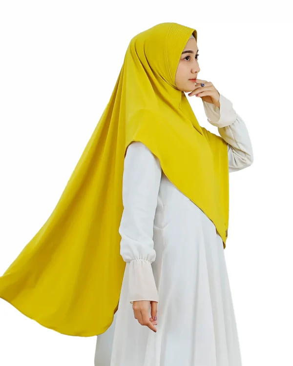 A woman models a Radiant Yellow Ribbed Hijab for Women, facing forward, highlighting the bright color and the ready-to-wear design with a chin-to-chest line.