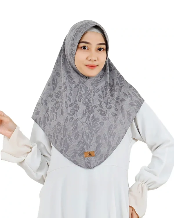 The rear view of a Chic Grey Hijab with Leaf Pattern, clearly showing the full coverage and the subtle, woven leaf design on the fabric.