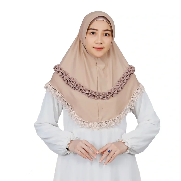 A woman models an Elegant Beige Ruffled and Lace Hijab, facing forward to showcase the beautiful scalloped lace trim and the decorative, voluminous ruffles across the chest.
