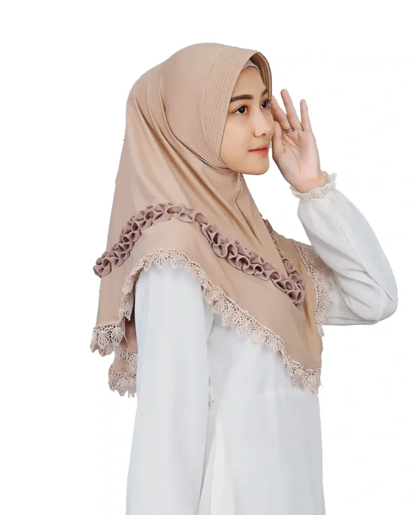 The rear view of the Elegant Beige Ruffled and Lace Hijab, highlighting the lace trim and the placement of the ruffle embellishments across the back.