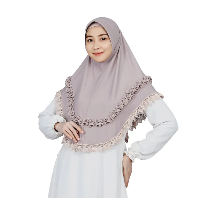 A woman models a stunning Mauve Grey Ruffled and Lace Hijab, facing forward and smiling, highlighting the decorative lace trim and the ruffled layers across the chest.