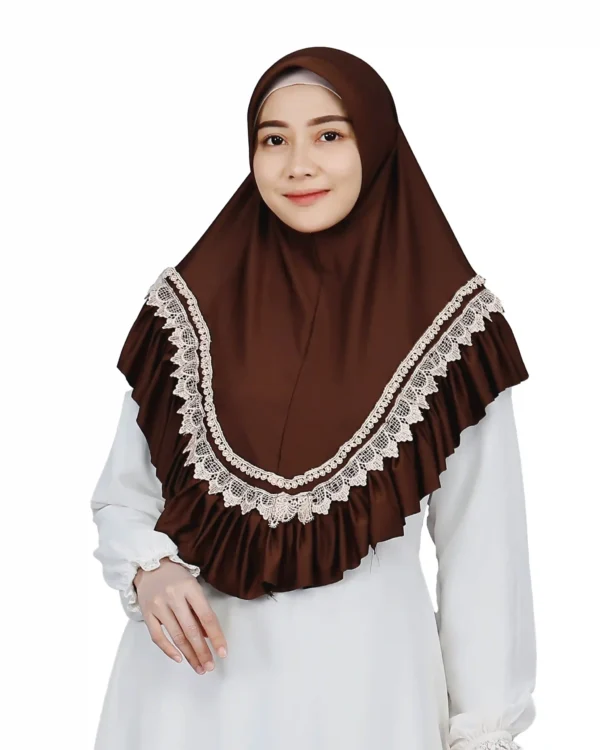A woman models a Dark Brown Lace and Ruffle Hijab, viewed from the side, showcasing the contrasting white lace trim and the layered ruffles along the hem.