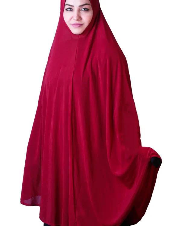 A woman modeling a luxurious Red Satin Hijab for Women, facing forward with her arms spread, highlighting the wide, flowing coverage and rich, vibrant color of the fabric.