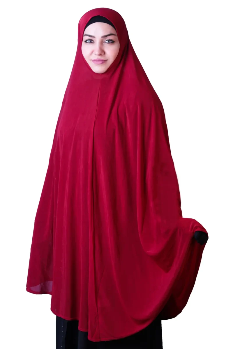 A woman modeling a luxurious Red Satin Hijab for Women, facing forward with her arms spread, highlighting the wide, flowing coverage and rich, vibrant color of the fabric.